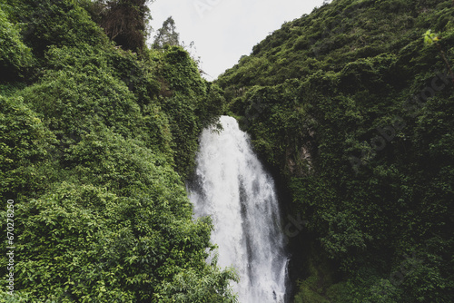 A picturesque waterfall in the forests of Ecuador on the outskirts of the city of Otavalo.