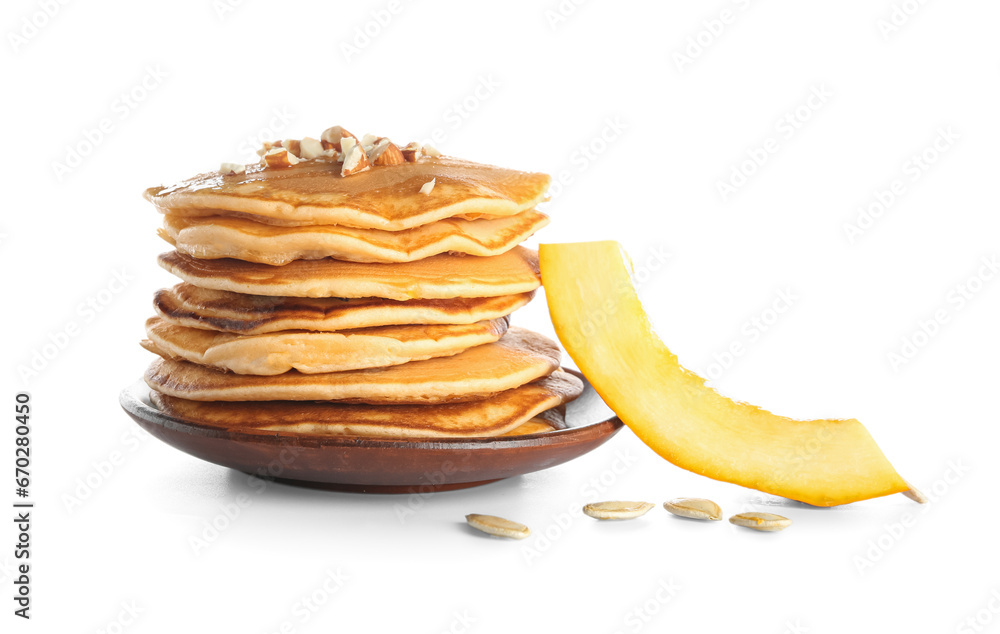 Plate of tasty pumpkin pancakes with nuts, honey and seeds on white background Plate of tasty pumpkin pancakes with nuts, honey and seeds on white background