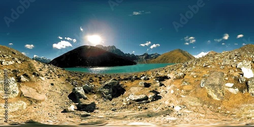 360 HD VR Gokyo Ri mountain lake at the winter season. Wild Himalayas high altitude nature and mount valley. Rocky slopes covered with ice. photo
