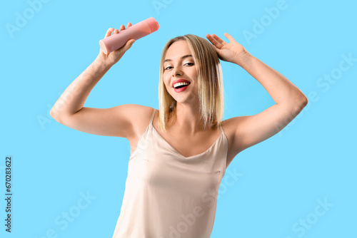 Young blonde woman with bot...