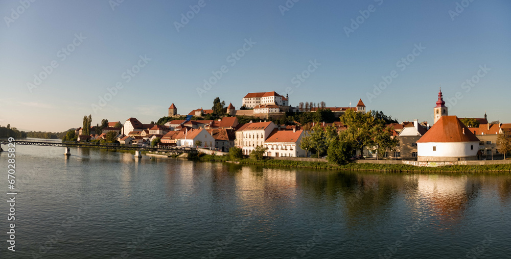 Obraz premium Ptuj in Slovenia, panoramic view with river Drava in foreground.