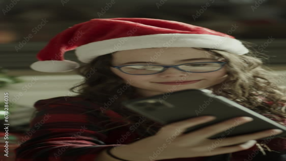 Close up of girl posing for cell phone selfie on Christmas - vertical video / Orem, Utah, United States Close up of girl posing for cell phone selfie on Christmas - vertical video / Orem, Utah, United States
