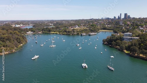 Aerial drone view of Berrys Bay and Waverton Peninsula on the lower North Shore of Sydney, New South Wales, Australia with Sydney City and Sydney Harbour in the background on a sunny day     photo