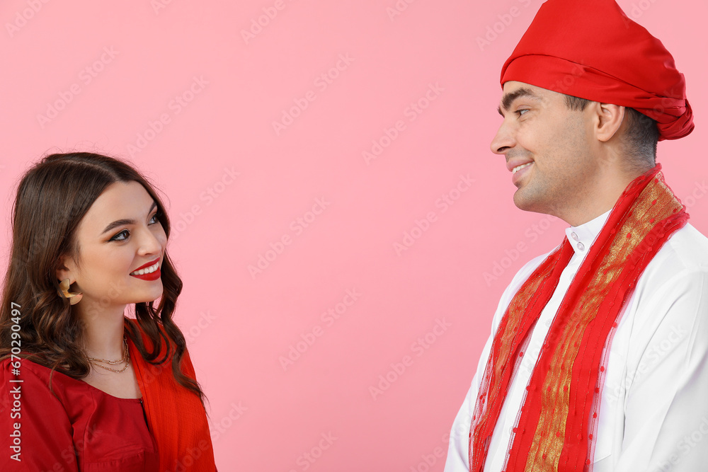 Beautiful Indian couple on pink background Beautiful Indian couple on pink background