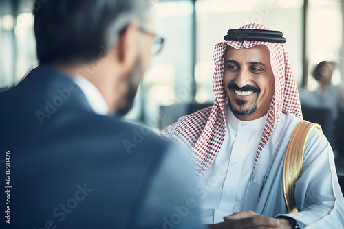 Smiling Arabian Sheikh in Close-Up Business Meeting photo