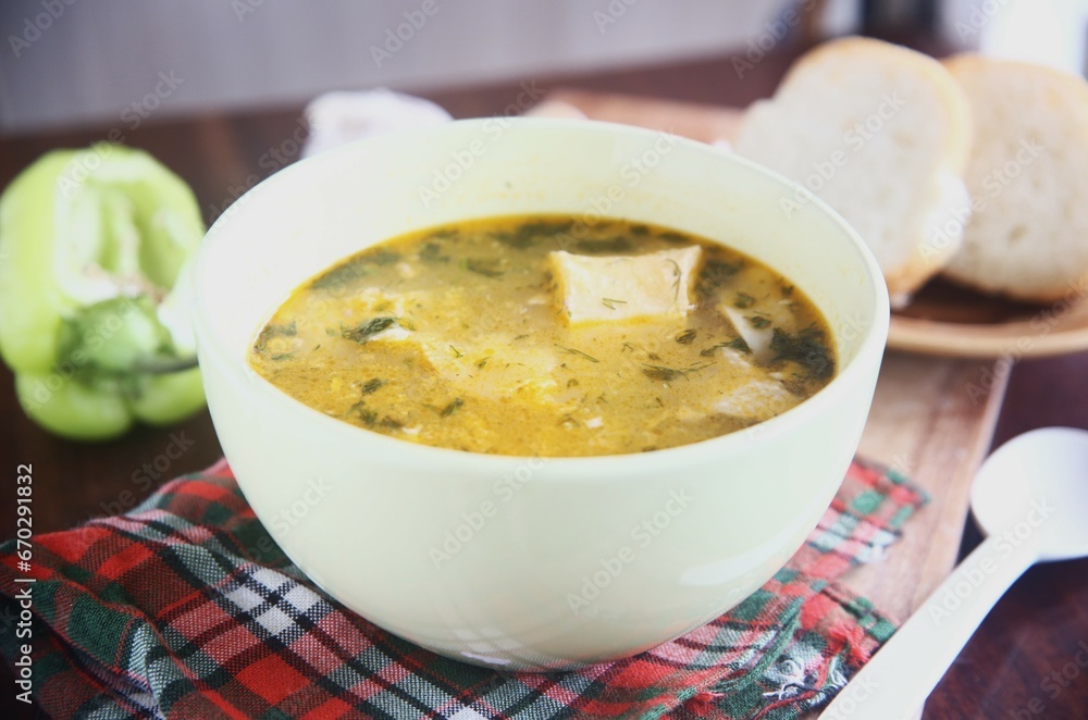 bowl of soup with bread and green pepper bowl of soup with bread and green pepper