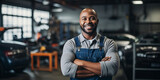 Smiling Car Mechanic with Crossed Arms in Auto Repair Shop