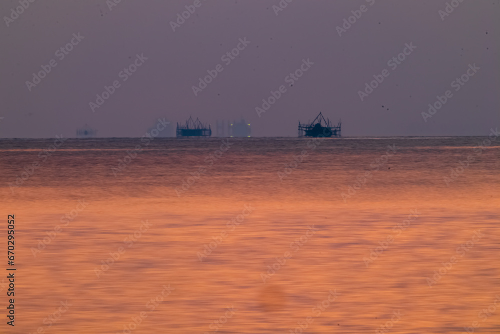 Fototapeta premium The view of the sunrise at the beautiful Panrita Lopi beach.