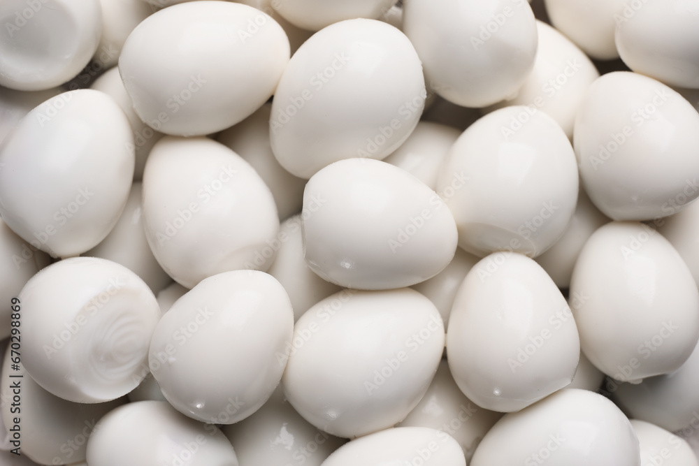 Peeled boiled quail eggs as background, top view Peeled boiled quail eggs as background, top view