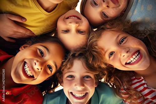 concept friendship view angle low smiling camera looking huddling kids happy portrait group fun having together playing children little cute joyful cheerful bunch friends smile day hug play photo