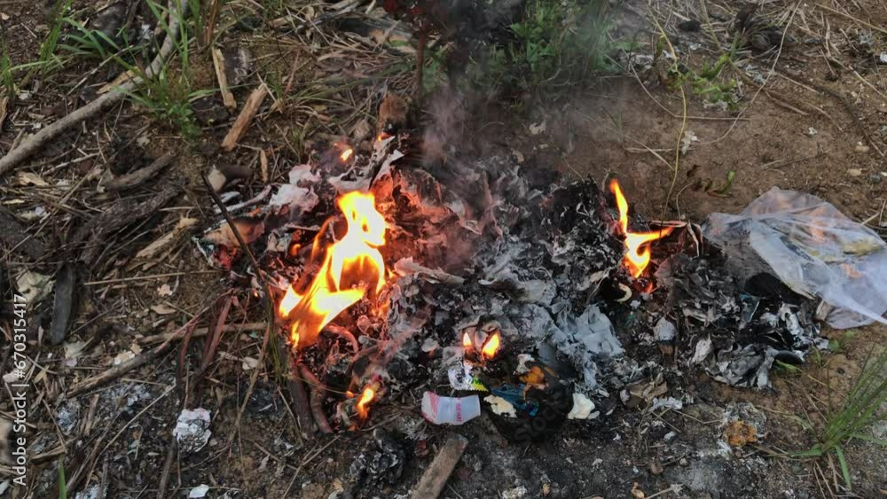 rubbish burn on the ground. waste burning . 4k resolution video rubbish burn on the ground. waste burning . 4k resolution video