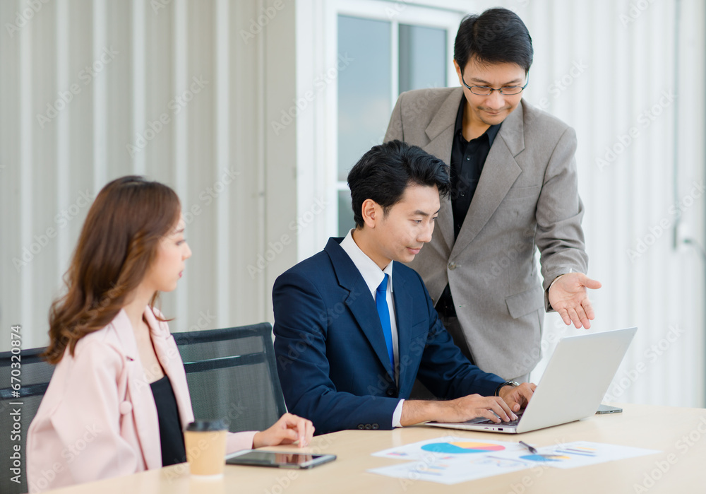 Asian professional successful male female businessmen businesswomen employees staffs in formal business suit outfit sitting standing important job deal done together Asian professional successful male female businessmen businesswomen employees staffs in formal business suit outfit sitting standing important job deal done together