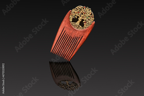 wooden women's comb hair clip with gold insert and precious stones on a black background