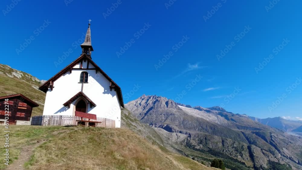 Church in Swiss Alps by Aletsch glacier, mountain landscape Church in Swiss Alps by Aletsch glacier, mountain landscape