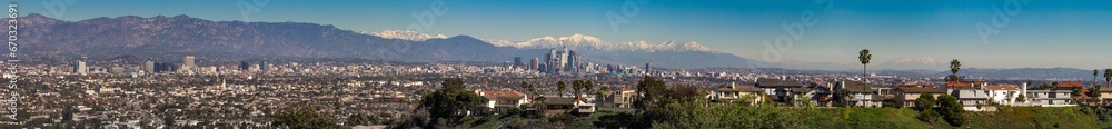 Los Angeles City Skyline with snow view from afar of Downtown with snowed mountains during winter Los Angeles City Skyline with snow view from afar of Downtown with snowed mountains during winter