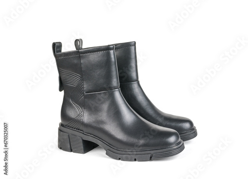 Black leather women's ankle boots isolated on a white background.
