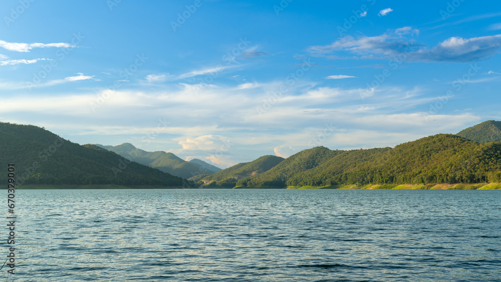 Scenic serenity idea of reservoir water, hills and sky