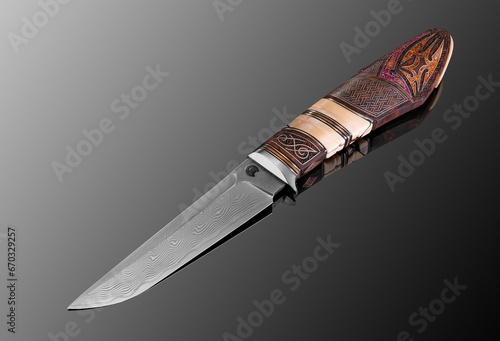 forged sharp handmade knife with multilayer steel with a wooden handle inlaid with gold