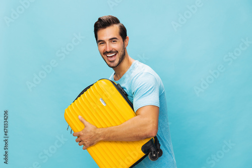 Vacation man travel trip yellow studio suitcase journey background traveler baggage flight weekend happy