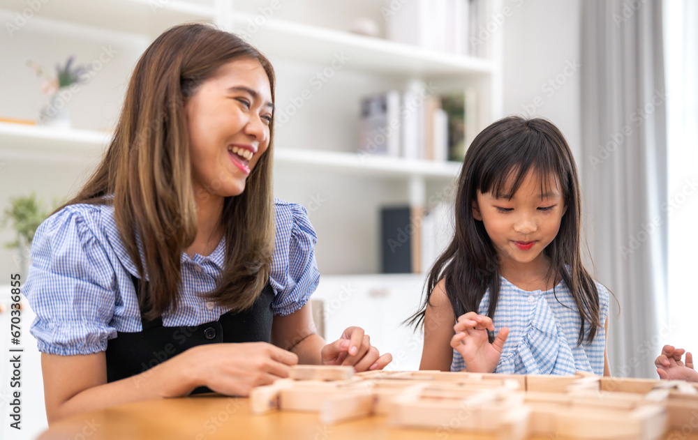 Portrait of enjoy happy love asian family mature mother and girl daughter smiling play and having fun together, mom, mother day, care, kid, child.happy family in moments good time at home Portrait of enjoy happy love asian family mature mother and girl daughter smiling play and having fun together, mom, mother day, care, kid, child.happy family in moments good time at home