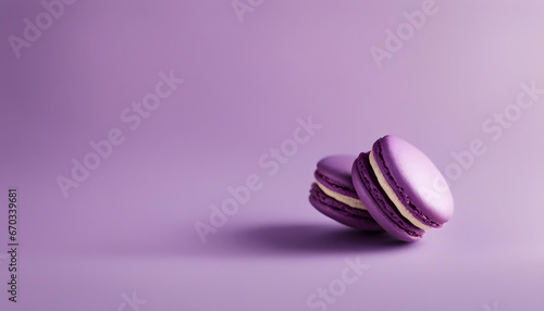 purple macarons filled with vanilla cream in the soft background. photo