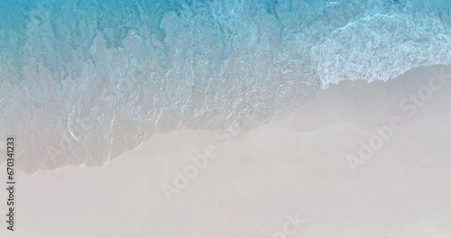 Beach Wave water in the Tropical summer beach with sandy beach background