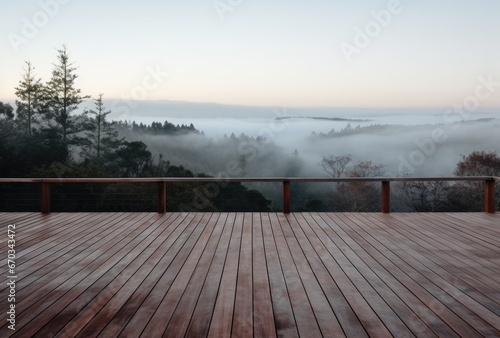 Empty deck overlooking fogcovered countryside.