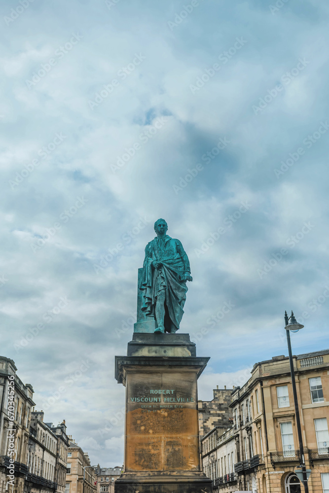 Fototapeta premium Statue of the 2nd Viscount Robert Melville on concrete plinth under cloudy sky.