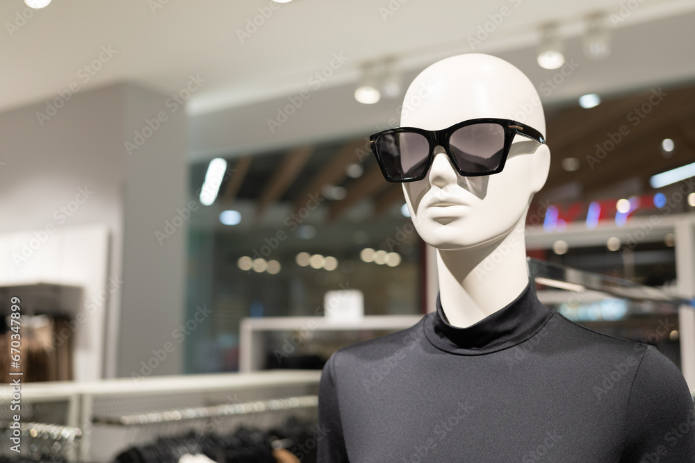 Mannequin wearing the sunglasses in the clothing store. Portrait mannequin and sunglasses. Mannequin wearing the sunglasses in the clothing store. Portrait mannequin and sunglasses.
