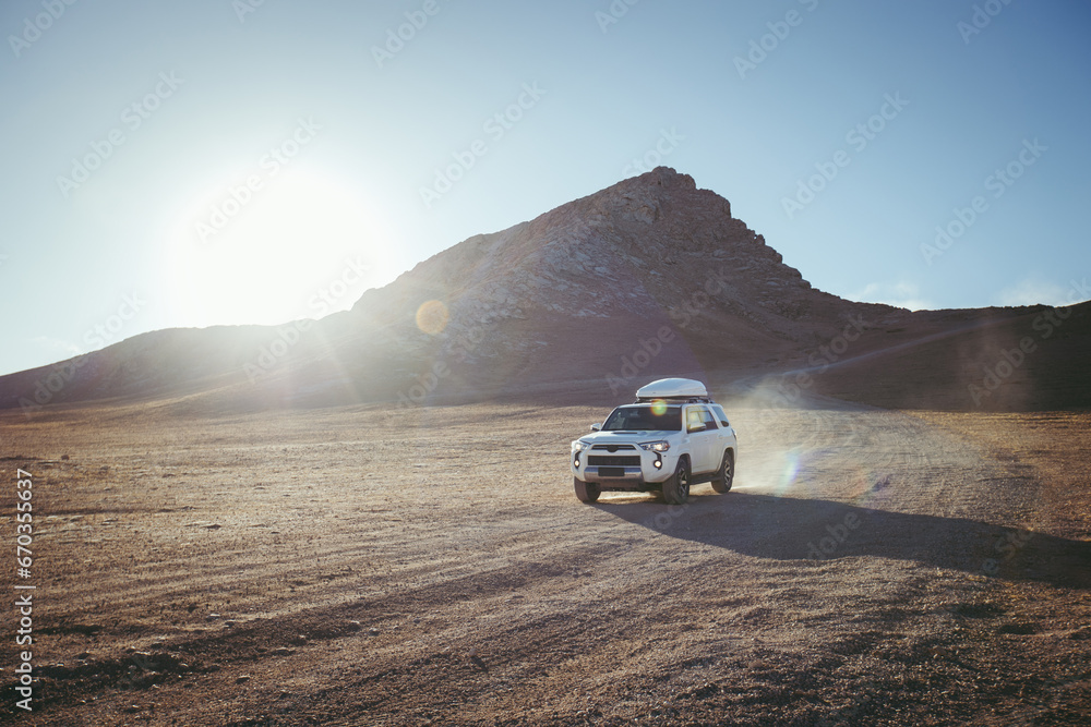 Driving off road car on the high altitude mountain slope