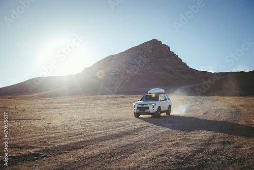 Driving off road car on the high altitude mountain slope © lzf