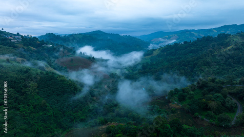 morning mist in the valley, north of thailand, ecological tourism concept, aerial panoramic drone point of view, © SHUTTER DIN