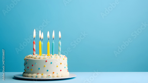 birthday cake with candle on blue background