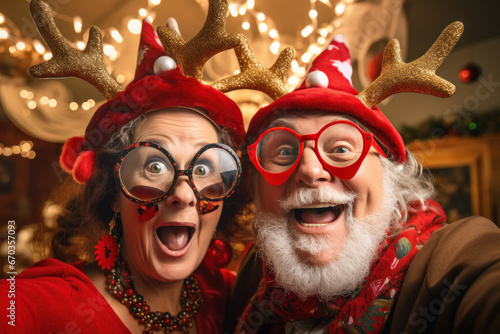 senior couple celebrating Christmas festival. © PRASANNAPIX