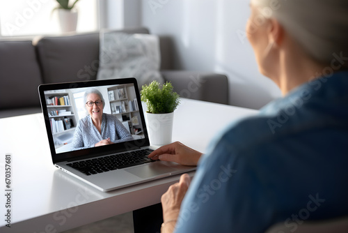 Female doctor therapist consulting older senior patient via virtual video call visit using laptop computer. Digital online healthcare, distance telemedicine. Telehealth videocall photo