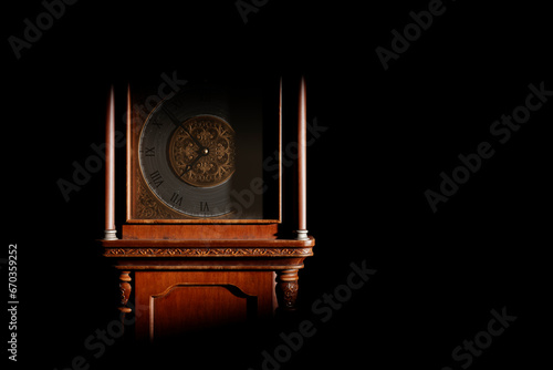 Close-up of the dial of an antique grandfather clock in a dark room, illuminated by light from the window.