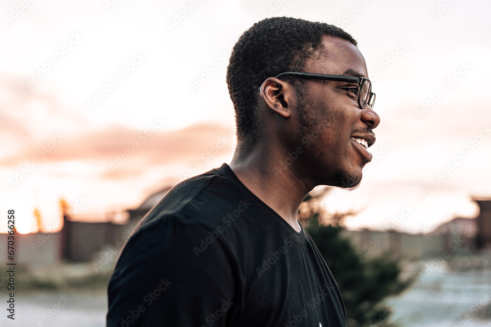 Young african man portrait standing in the street Young african man portrait standing in the street