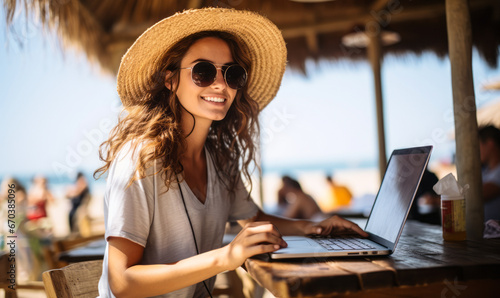 Sea, Surf, and Software: Woman Enjoys Wireless Technology at Beach Cafe