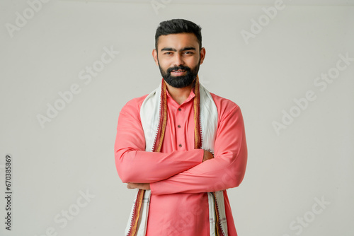 Young indian farmer giving expression on white background.