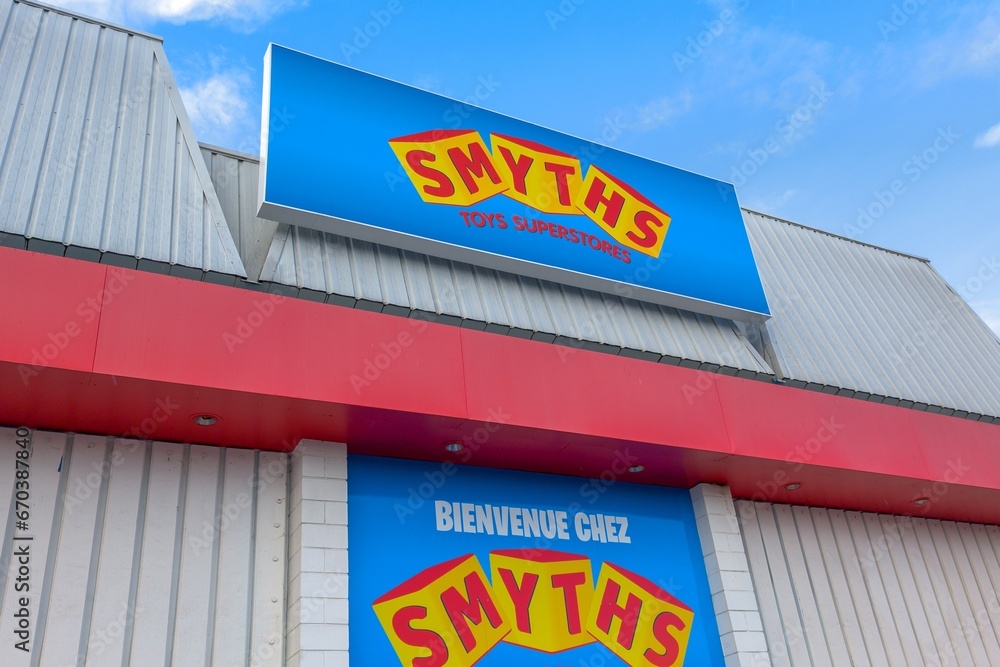 Smyths Toys Superstore logo brand and text sign in wall facade toys ...