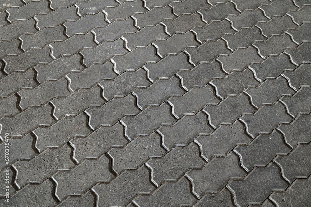 Fototapeta premium brick paving stones on a sidewalk background texture