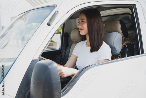 Photo of young Asian woman with her truck © Timeimage