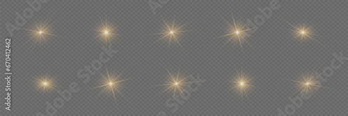Wallpaper Mural Golden glowing light explodes on a transparent background. A set of sparkling magical dust particles. Bright Star. Transparent sun, bright flash. Vector sparkles. Torontodigital.ca