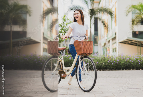 Fototapeta Naklejka Na Ścianę i Meble -  Photo of young Asian woman with bicycle