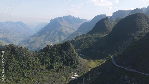 Drone moves sideway to reveal windy Ma pi leng pass and marvelous mountain range of Ha Giang Viet Nam photo