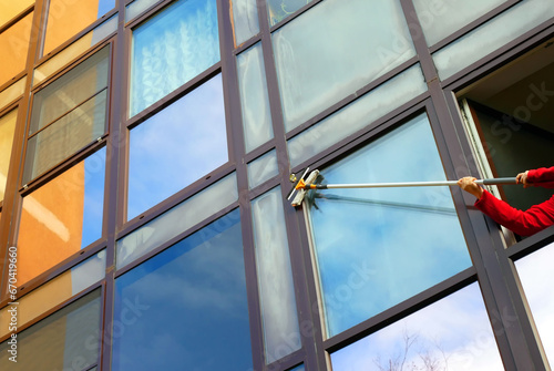 Washing windows with a window brush. Window cleaning brush for windows.