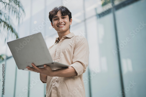 Photo of young Asian business people working outdoor