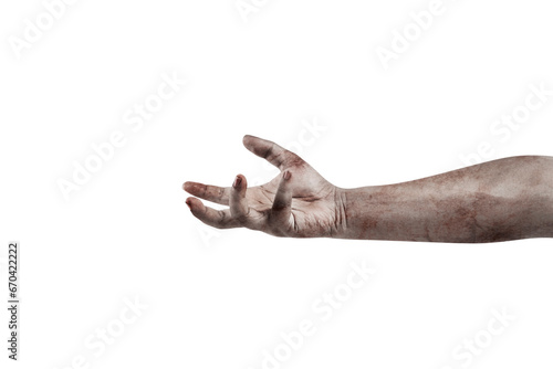 The hand of a scary zombie with blood and wounds photo