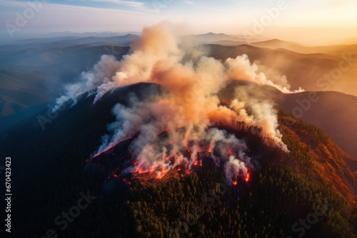 Wildfire on the mountain during the day -