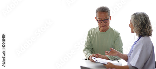 Senior health care concept. Doctor with patient in medical office. Retired man sits in a hospital examination room while discussing his health with a doctor.
